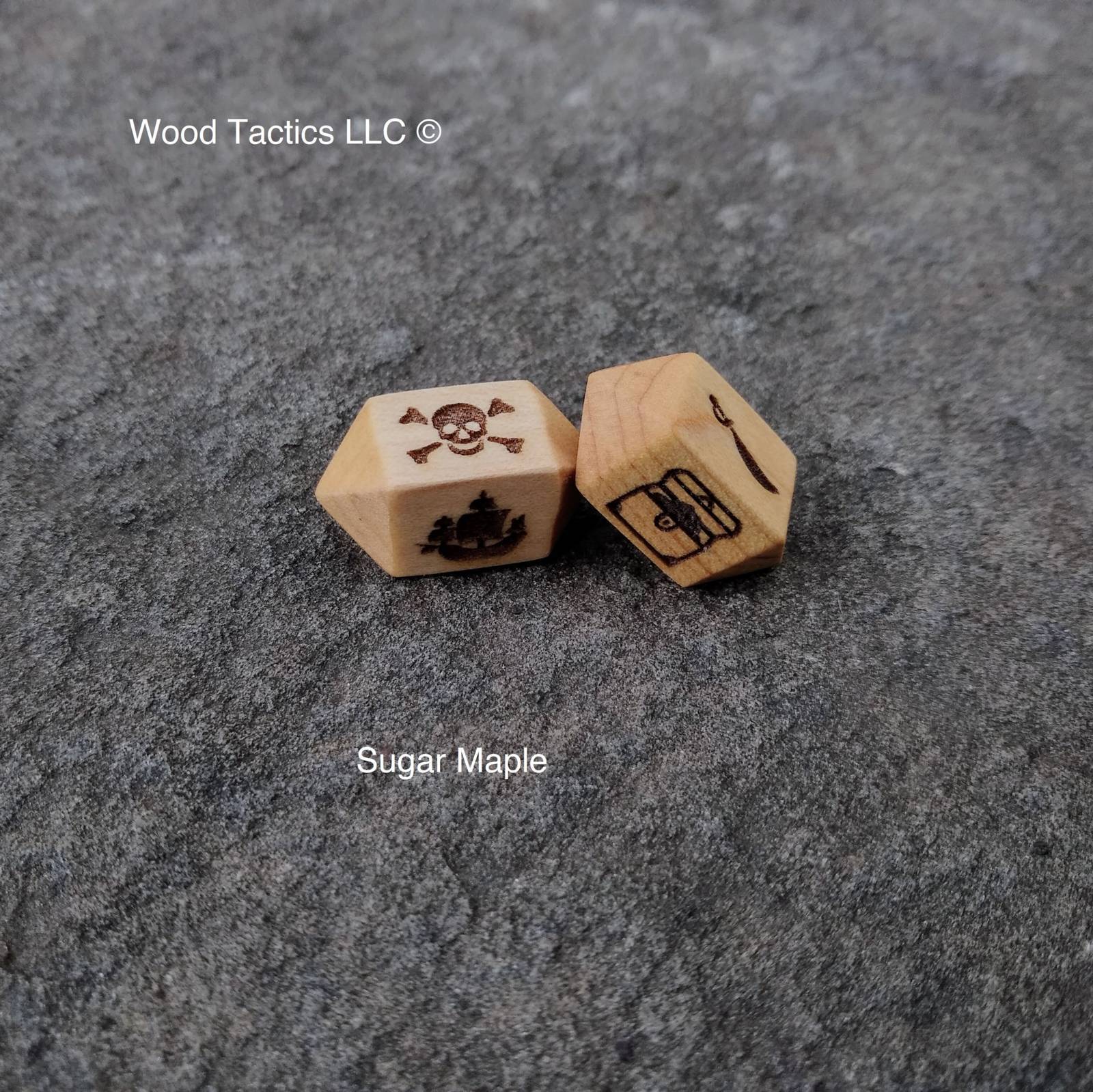 Maple Hardwood Barrel D4 dice for bluffaneer game. Symbols are Pirate Ship, Skull and Pones, Treasure Chest and Sword.