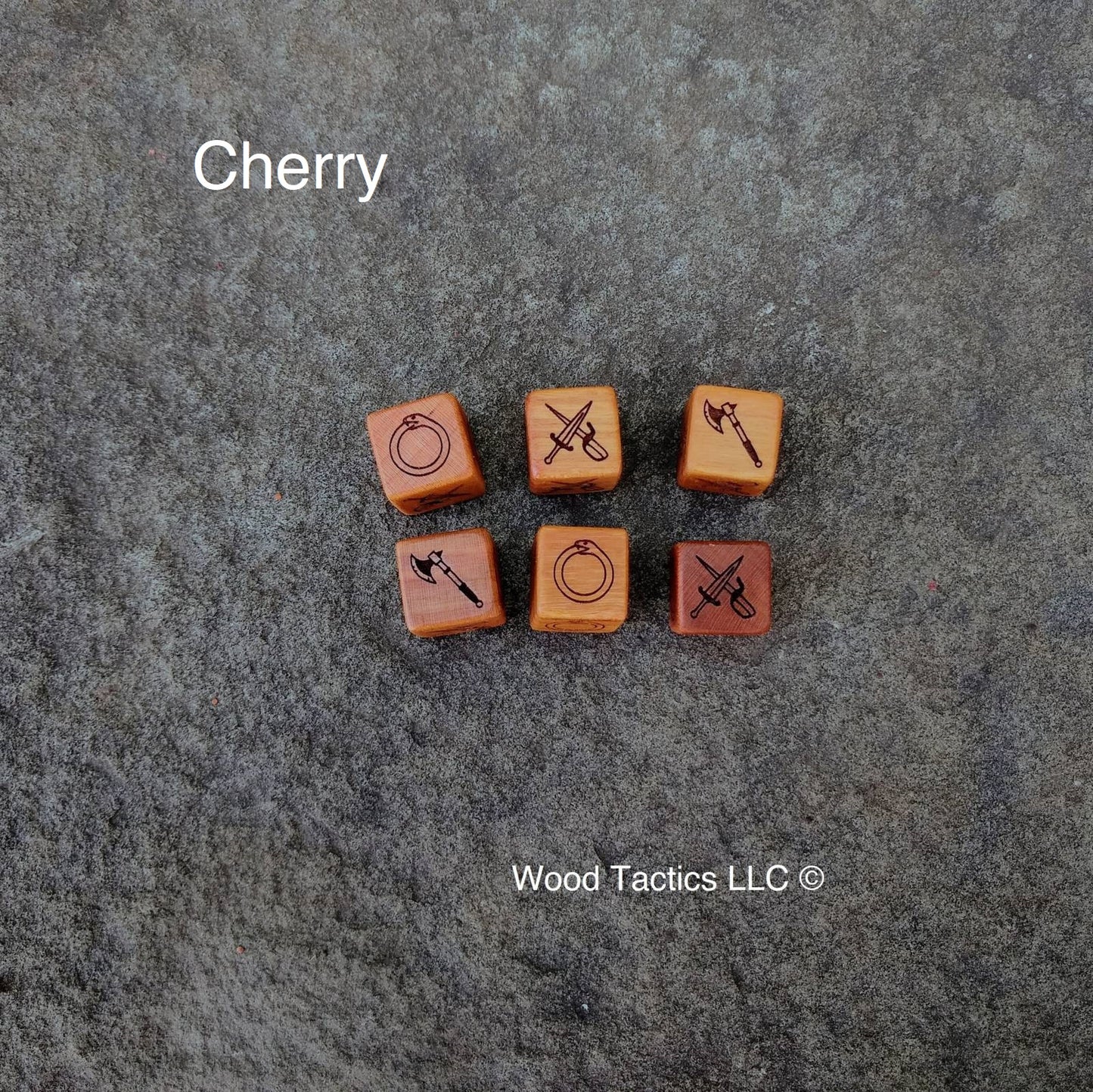 Cherry Hardwood Mouse Guard Roleplaying game dice with Axe, Ouroboros, and Crossed Dagger Symbols