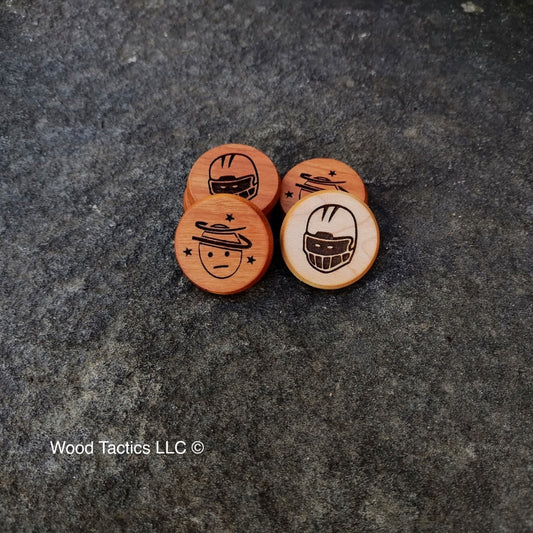 Blood Bowl Prone and Stunned Tokens made from Maple and Cherry Hardwood. Featuring generic helmet and face with swirly stars.